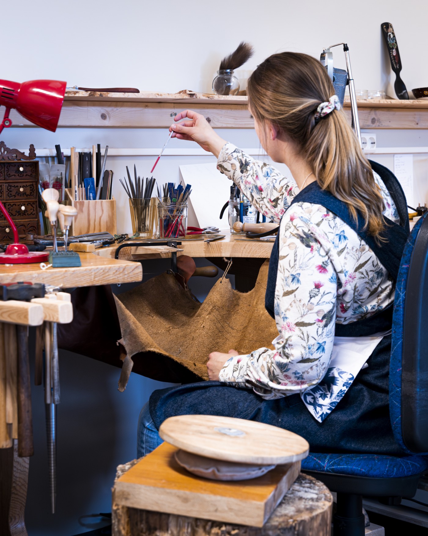 Mhait Hulbert at her jewellry workshop table