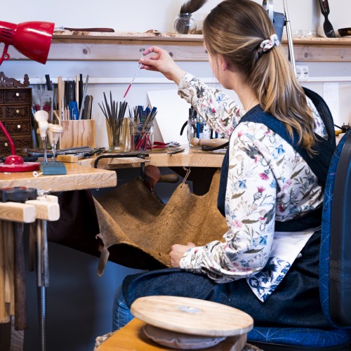 Mhait Hulbert at her jewellry workshop table